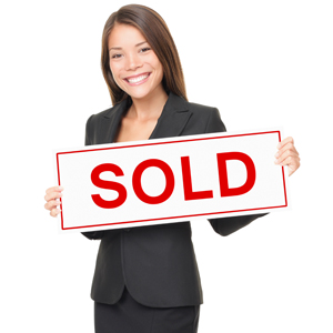 Real Estate Agent Holding a Sold Board - Real Estate Agents Are Not Mold Experts!