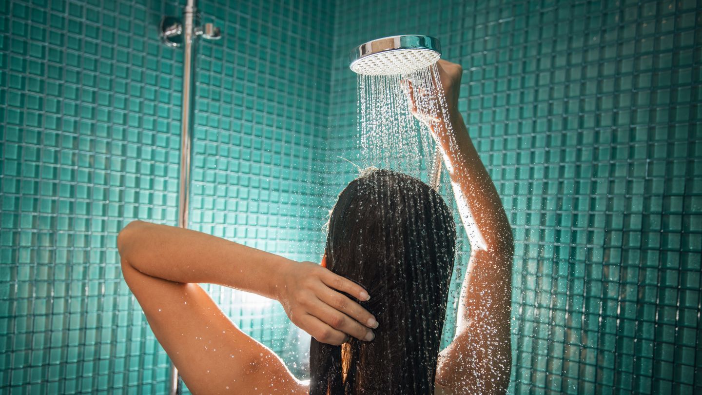 Woman Washing Her Hair In A Shower